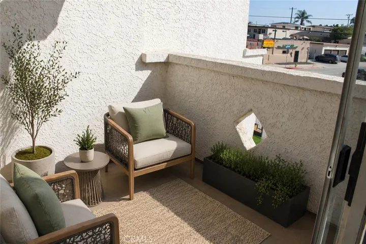 Relax in the private balcony (staged)