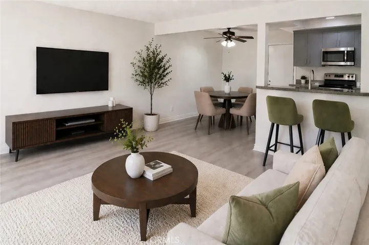 Living room and dining area (staged)