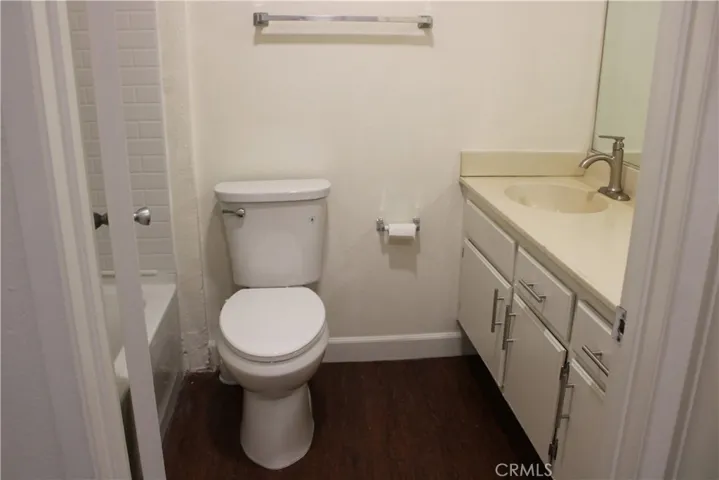 Upstairs Hallway Bathroom with new tub, fixtures, and toilet
