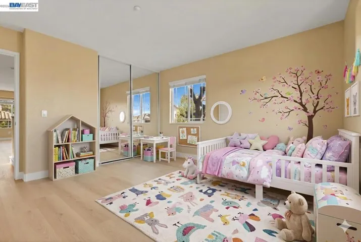 Bedroom 1 - virtually staged as a girl room