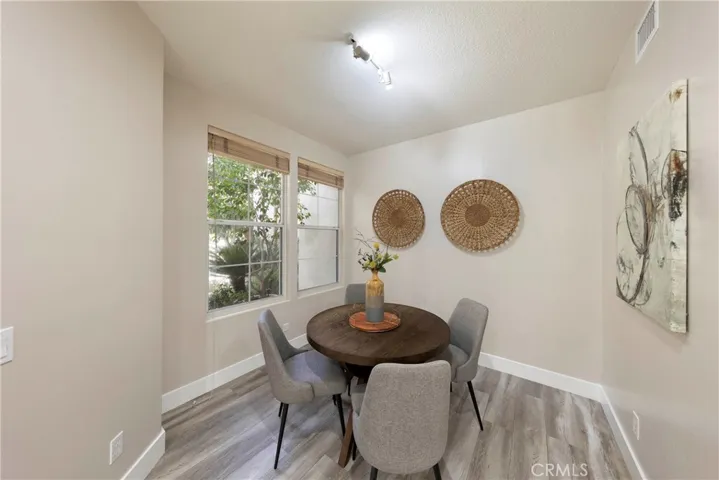 Breakfast nook tucked in front of home with views of front courtyard.