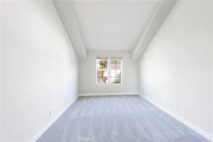 Secondary bedroom with ensuite bathroom and ample closet.