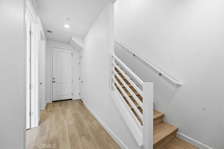 Entry from Courtyard LVP Flooring throughout