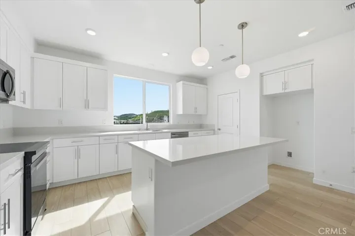 Large Kitchen Center Island and Pendant Lighting