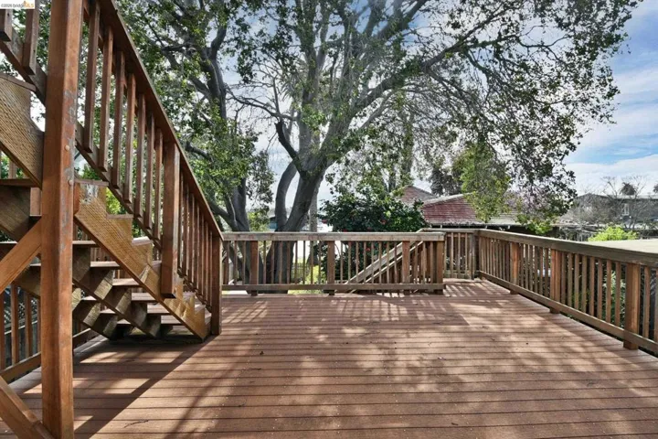 Wooden terrace featuring stairs