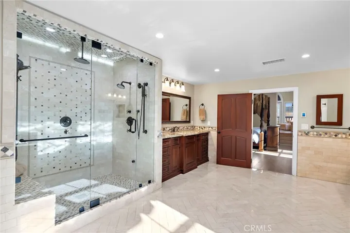 Primary Bathroom with Shower, Tub, Sauna, Massage Room, Walk-In Closet, and Washer/Dryer