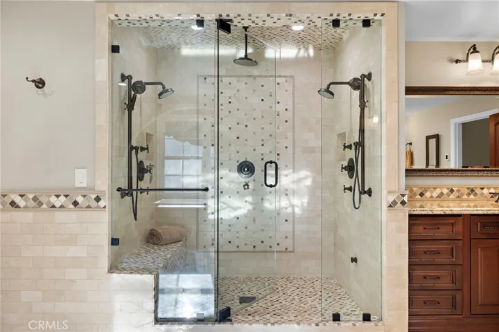 Primary Bathroom with Shower, Tub, Sauna, Massage Room, Walk-In Closet, and Washer/Dryer