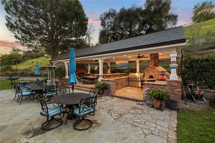 Backyard Built-in BBQ Area with Ample Seating