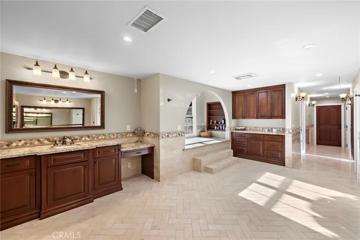 Primary Bathroom with Shower, Tub, Sauna, Massage Room, Walk-In Closet, and Washer/Dryer