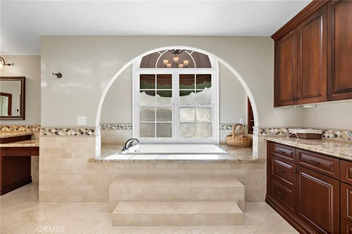 Primary Bathroom with Shower, Tub, Sauna, Massage Room, Walk-In Closet, and Washer/Dryer