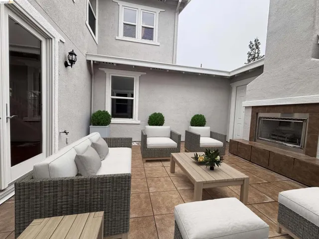 View of patio featuring an outdoor living space with a fireplace