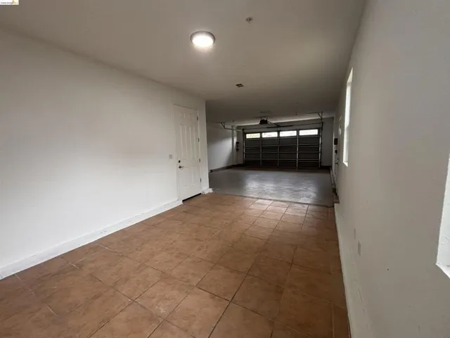 Empty room featuring baseboards