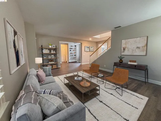 Living area featuring wood finished floors and baseboards
