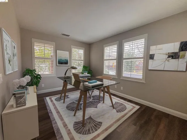 Office area featuring dark wood-type flooring