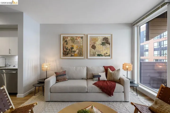 Living area featuring light wood-style flooring and baseboards