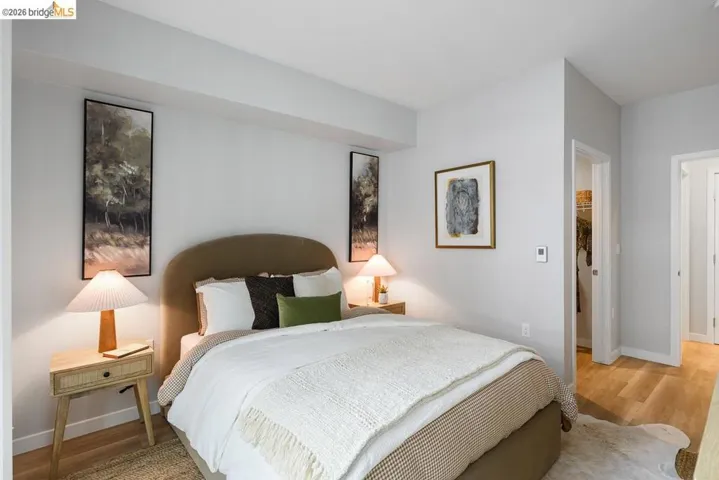 Bedroom featuring wood finished floors and baseboards