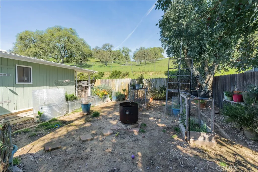 Backyard with garden boxes and open space behind property