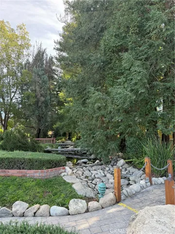 Gorgeous land scape, Koi Pone, stream right behind home..you can hear stream from the back yard