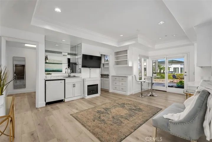 Fourth downstairs bedroom is a suite with sink, refrigerators, electric fireplace, built-in drawers, shelves and cabinets, private full bathroom and an extreamly large walk-in closet.  Perfect for a family member that needs privacy.
