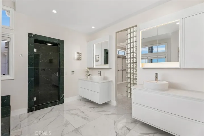 Primary bathroom with dual sinks, walk-in shower and large jetted tub with amazing views!  Private toilet closet.