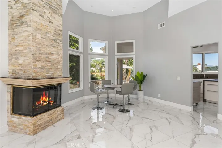 Dining area opens to kitchen and overlooks side yard.