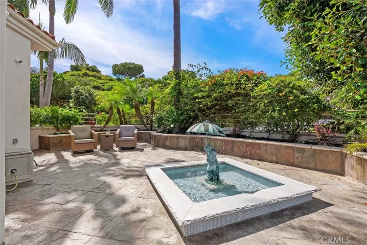 This water feature is off the kitchen and visable from the diningroom and can be enjoyed anytime while entertaining from this magnificant outdoor extended kitchen space.