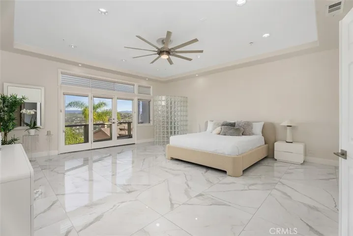 Primary bedroom with a king size bed...the room is very large with an outdoor balcony.