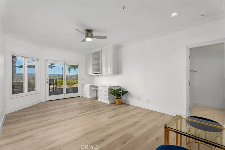 Third bedroom downstairs, it too has built-in desk with overhead cabinets, a walk-in closet with built-in drawers and it's own private bathroom.  Again, all these bedrooms have their own access to the single level outdoor patio with amazing views.