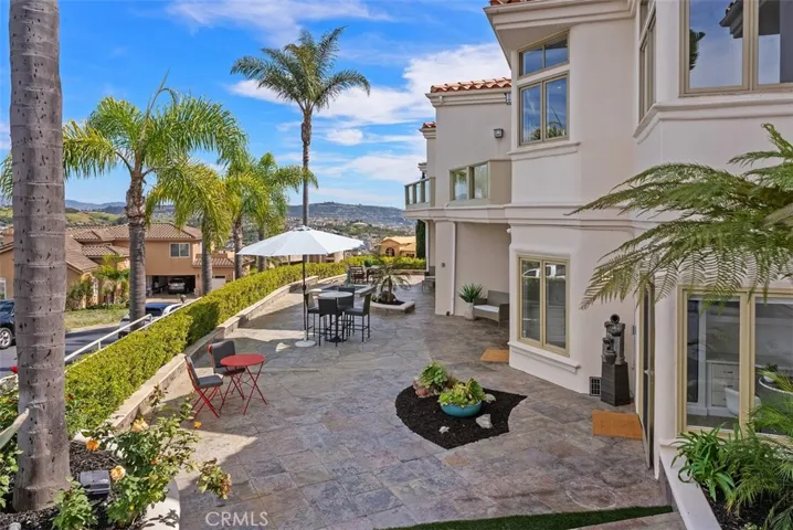 The wrap around lower patior with each bedroom having access to this tranquil patio just off the cul-de-sac, which can also be seen from the upstairs balconies off the living room and primary bedroom.  Very low maintenance yard!
