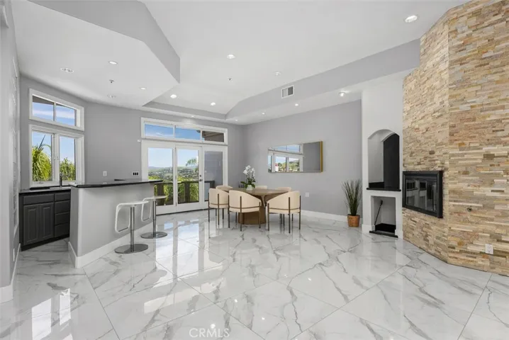 Second fireplace can be used at an additional dining area or familyroom with wetbar.