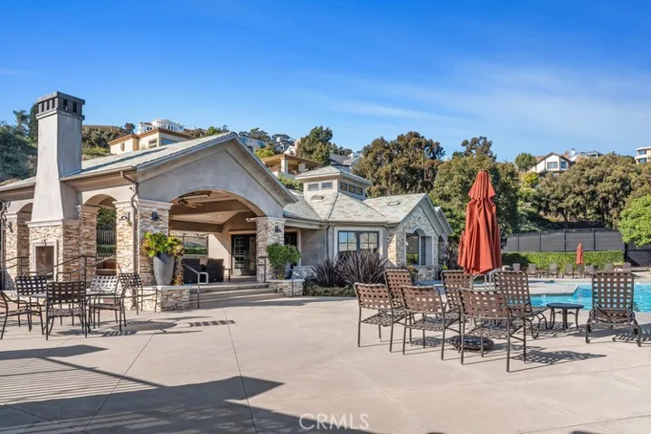 Community club house with sitting areas, fireplace, tv, ping-pong, tennis, tot lot, putting green, dog park, pool and spa. NO MELLO Roos and low HOA!