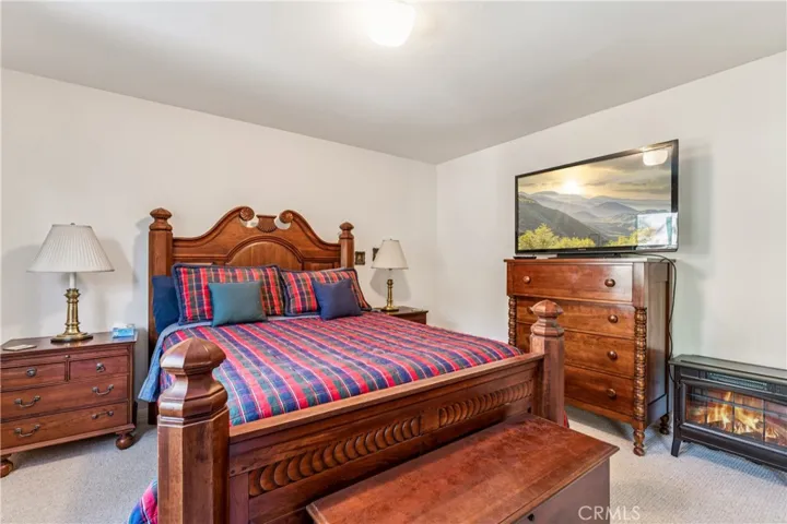 guest bedroom 3 with electric fireplace