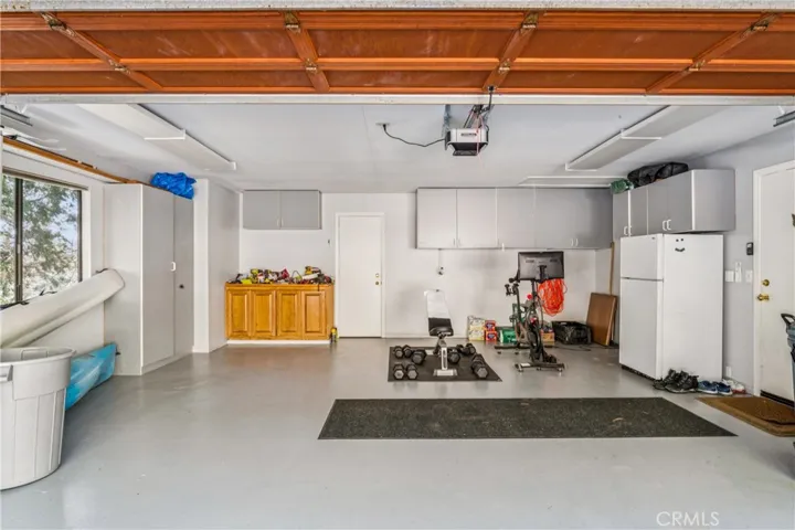2 car garage with extra storage and epoxy floor