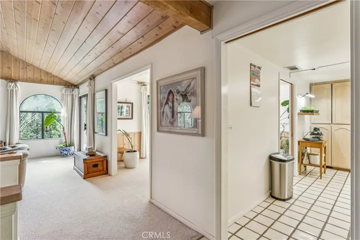 transition to living room, open to dining room