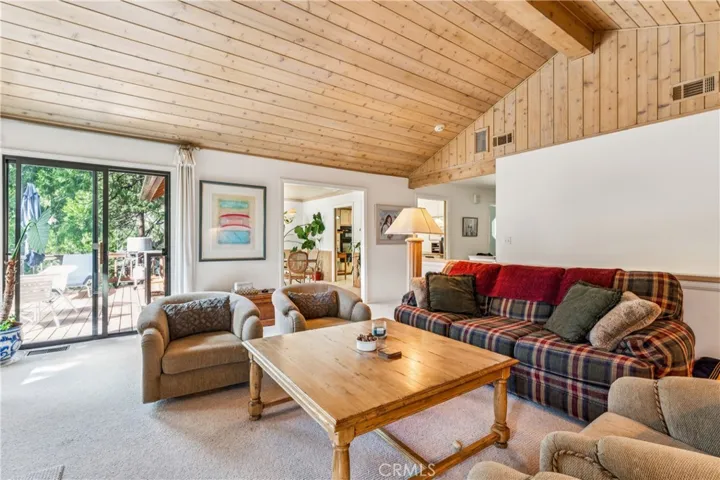 living room with access to backyard deck