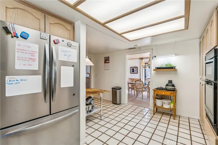 Easy care flooring; pocket door for privacy while dining