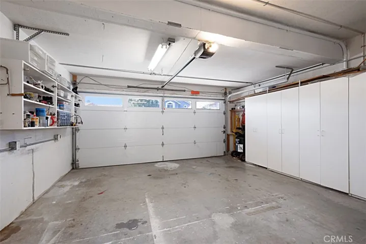 Garage with extensive cabinetry, compressed air, extra electric outlets