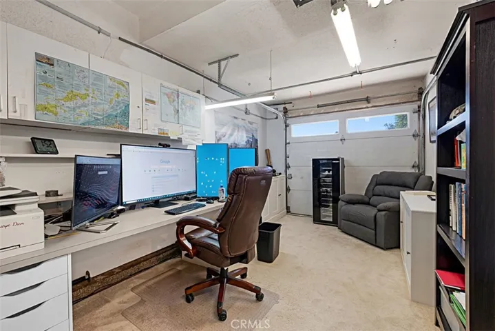 3rd garage area has been used as office with extensive wiring for security systems and computing. This area has its own AC.