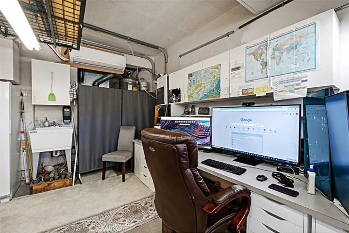 AC "split" unit on wall in garage bay 3