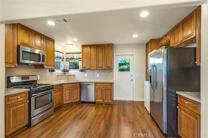 Kitchen with door to side yard