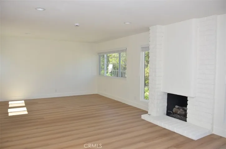 Primary Suite retreat/office area - with fireplace and big windows for lots of light.