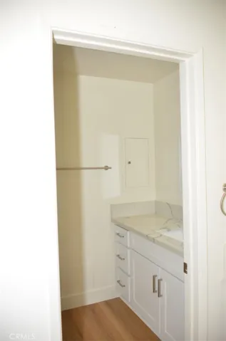 The second vanity and sink area includes the toilet and shower.