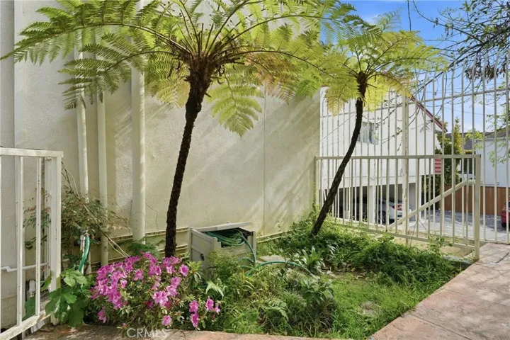 Courtyard at the back of building leading to the garage
