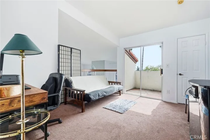 Loft with a closet and view of the park and neighborhood