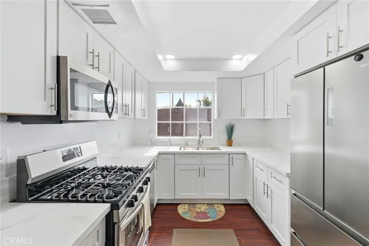 Kitchen with quartz countertops and sleek cabinetry