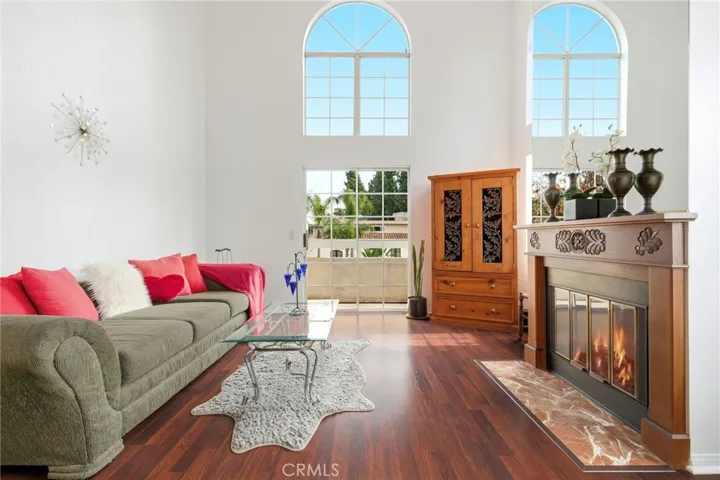 Living room with views of the park and neighborhood