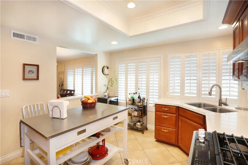 Kitchen has a pass-through window to the dining area.