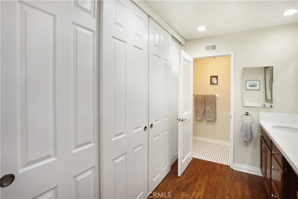 Large closet with sliding doors.