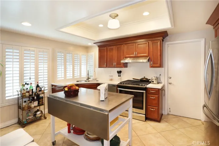 Another view of the spacious kitchen. The door accesses the 2-car garage and laundry area.