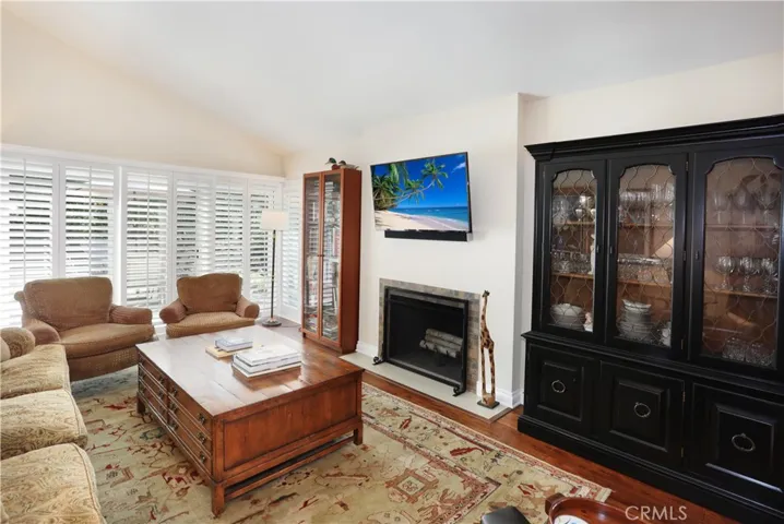 Fireplace gas line is capped off but can burn wood. TV and sound bar below it can stay with the property.